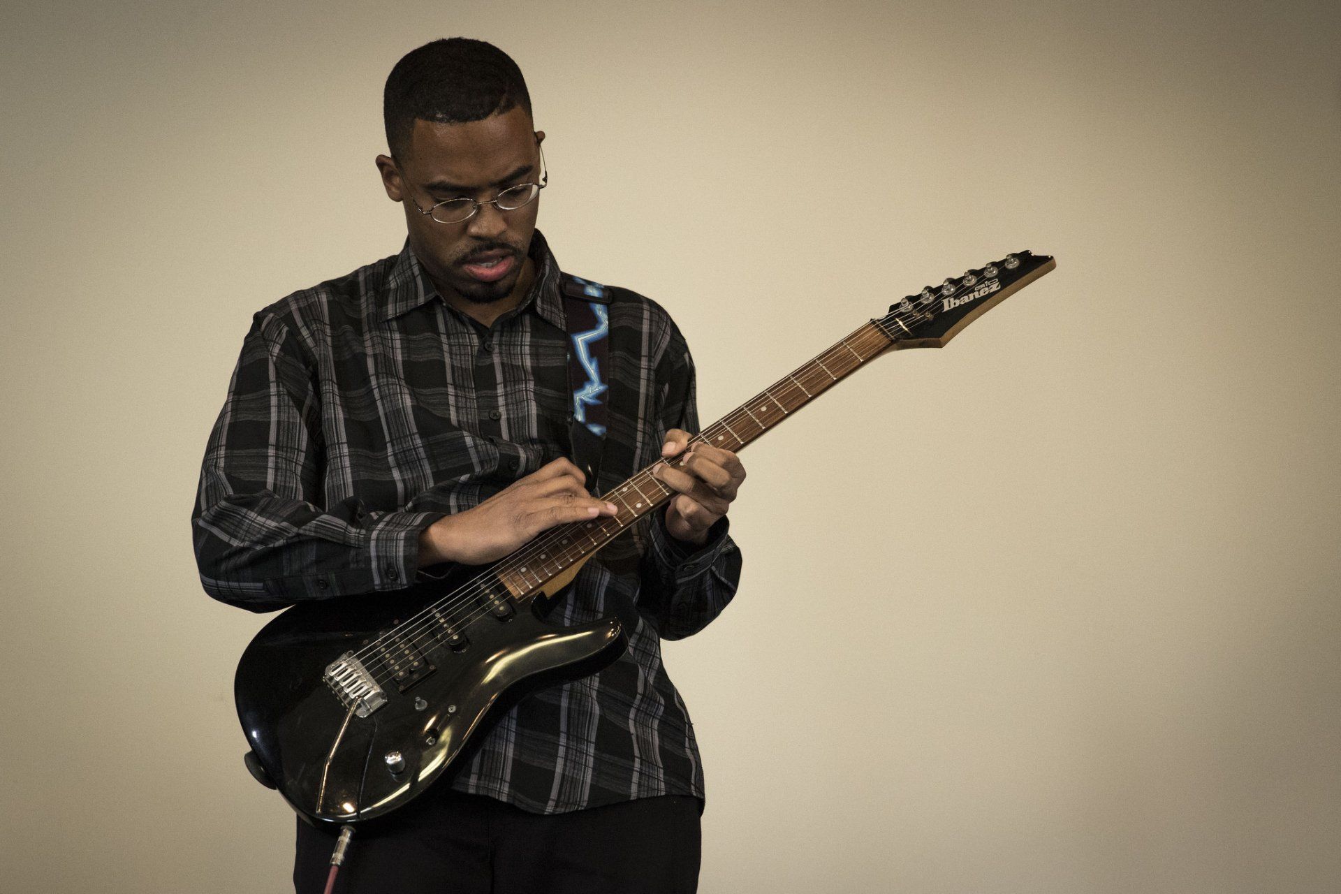 A guitarist poses with his electric guitar