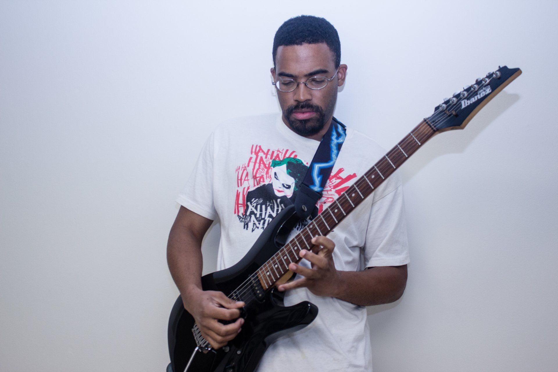 A guitarist poses in the studio