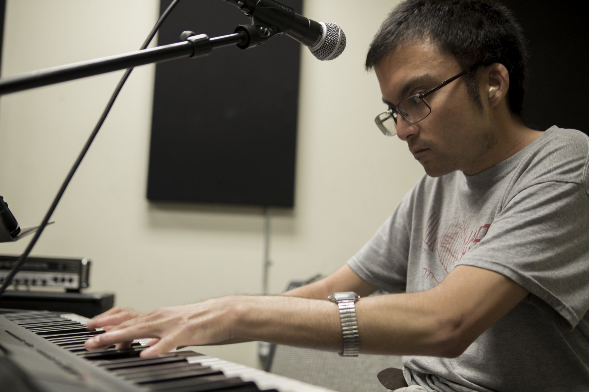 A pianist tracks keys in the studio
